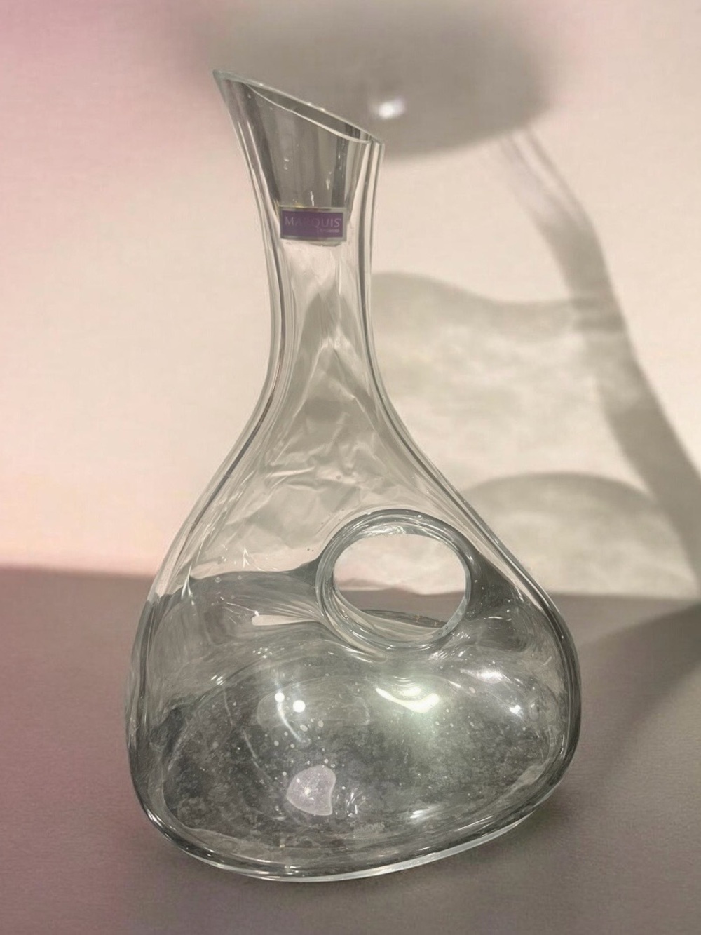 Marquis by Waterford glass decanter with an asymmetrical cutout.